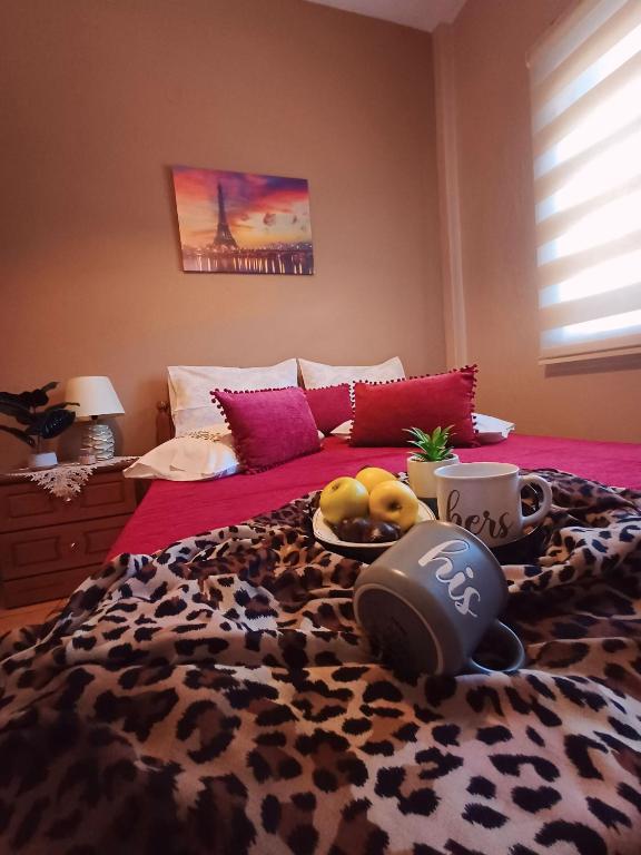 a bedroom with a leopard bed with a leopard blanket at Room Ntina Kastraki in Kastraki