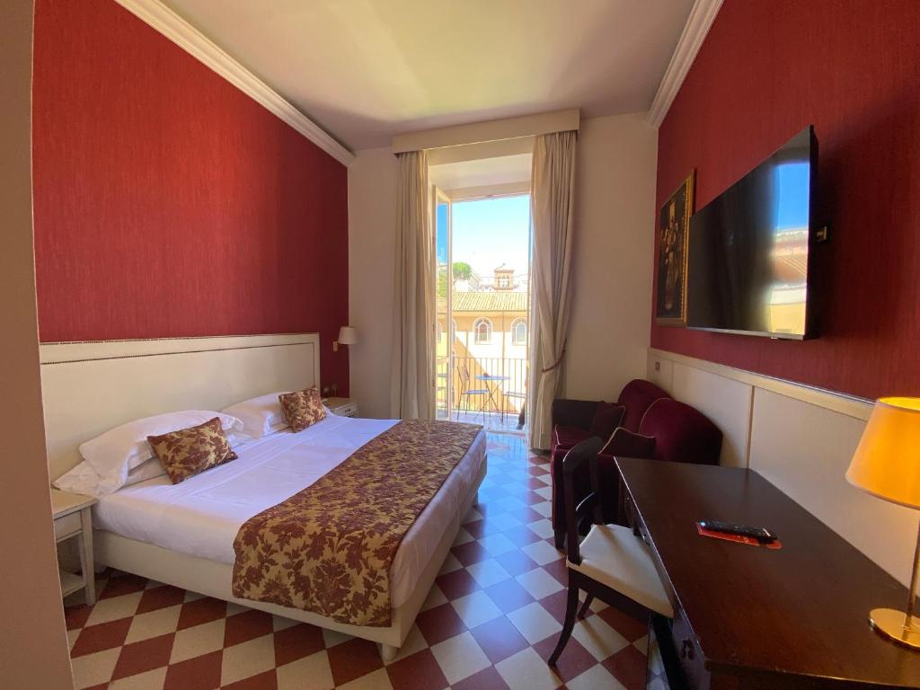 Postel nebo postele na pokoji v ubytování Basilica Hotel