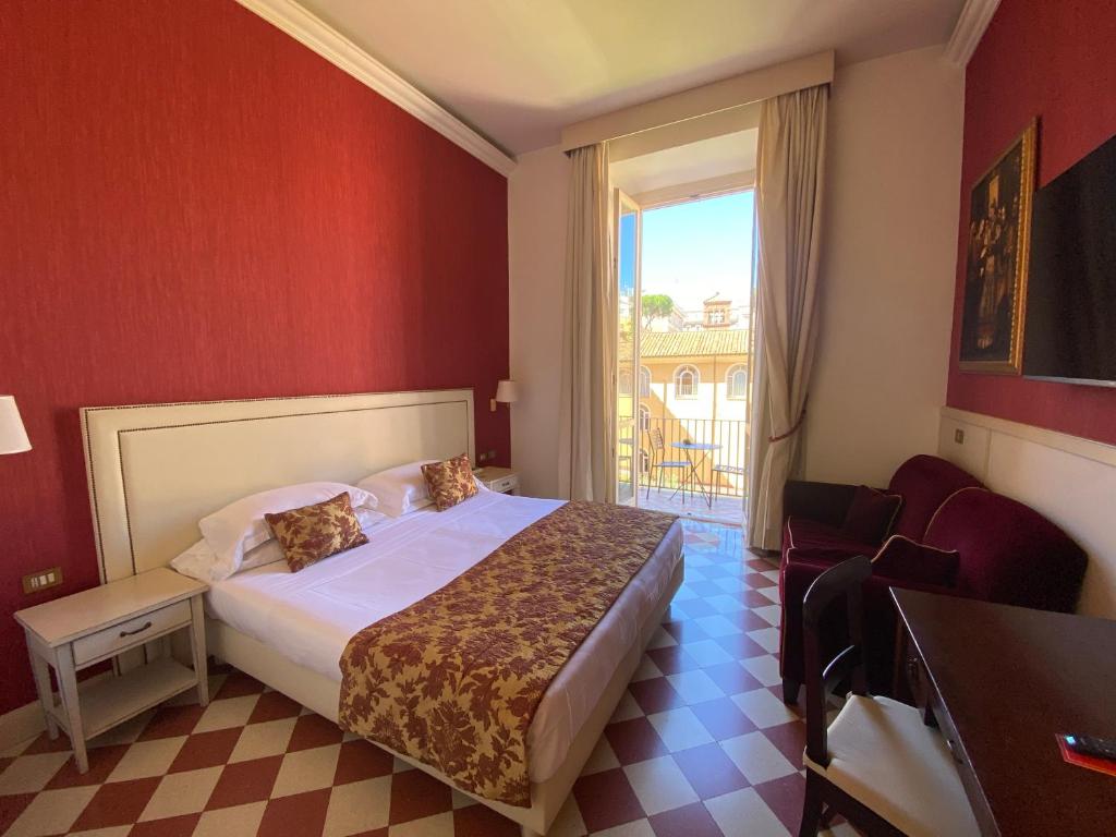 Postel nebo postele na pokoji v ubytování Basilica Hotel