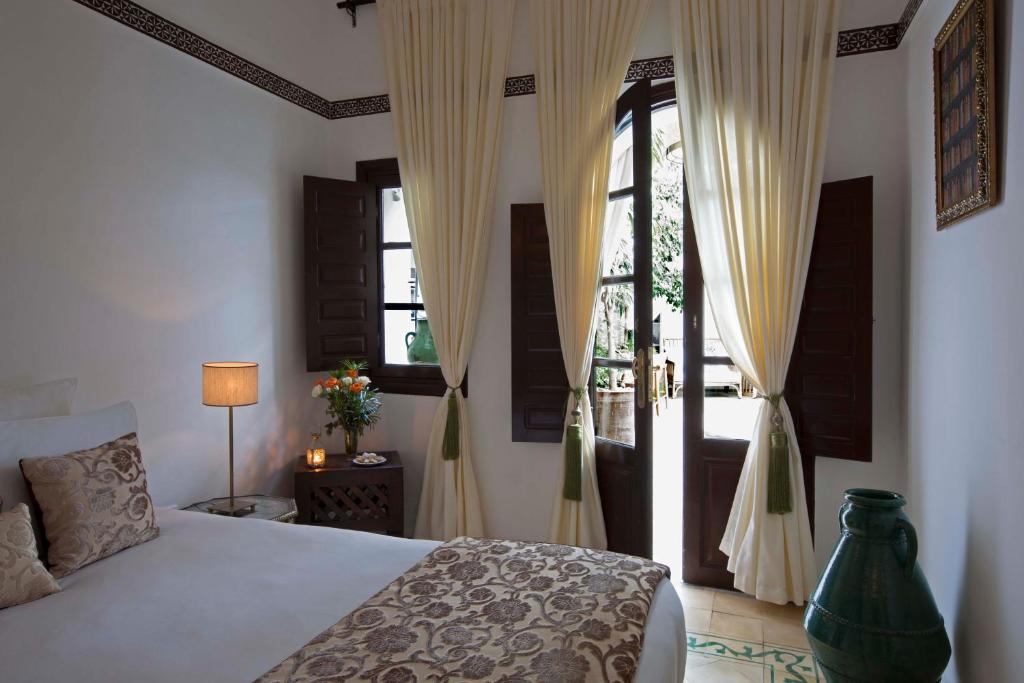 Ein Bett oder Betten in einem Zimmer der Unterkunft Riad Dar Alfarah