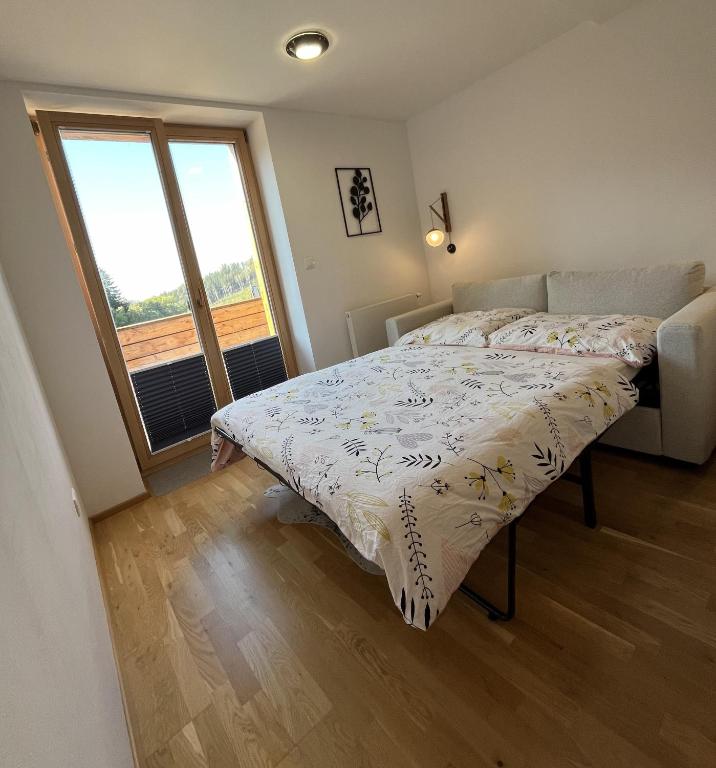 Postel nebo postele na pokoji v ubytování Slunečný apartmán