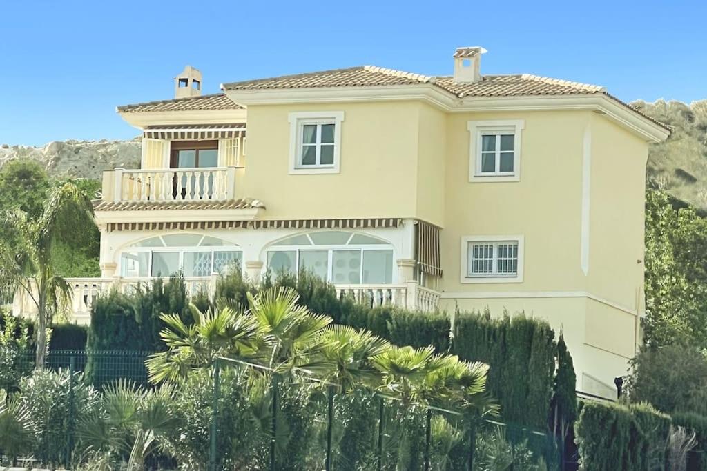 a large house with a fence in front of it at 6 Bedroom Luxury Villa, Jacuzzi & heated pool 18 guests in Mutxamel