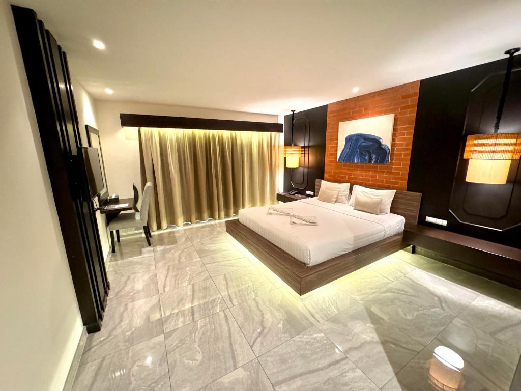 Postel nebo postele na pokoji v ubytování De Cozé Hotel