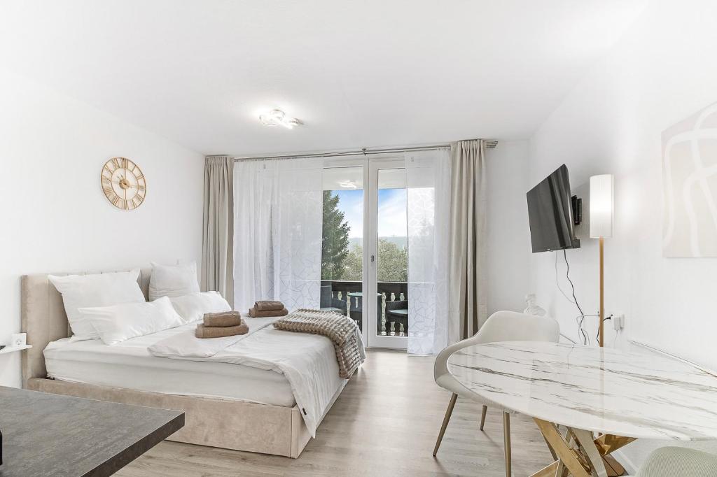 Ένα ή περισσότερα κρεβάτια σε δωμάτιο στο Apartment Cosy - an Skipiste und Bikepark