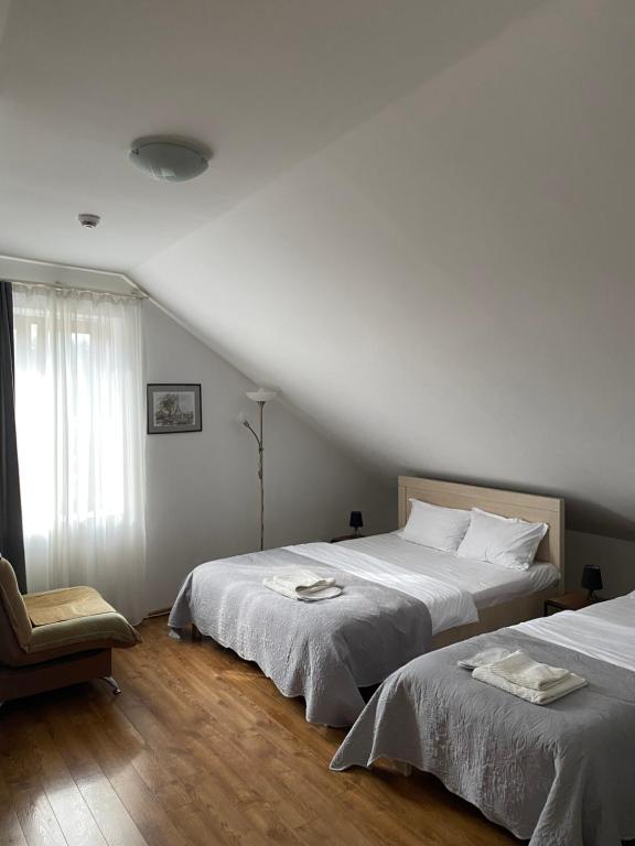 Postel nebo postele na pokoji v ubytování Hotel Cité