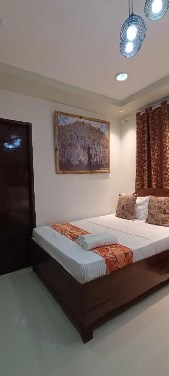 Postel nebo postele na pokoji v ubytování Layang Layang Home