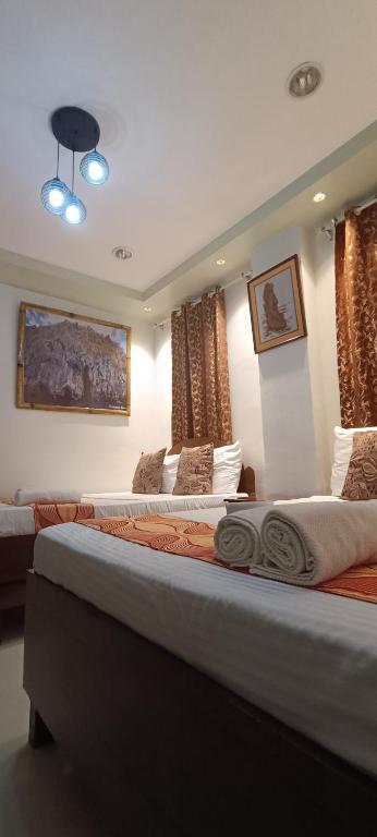Postel nebo postele na pokoji v ubytování Layang Layang Home