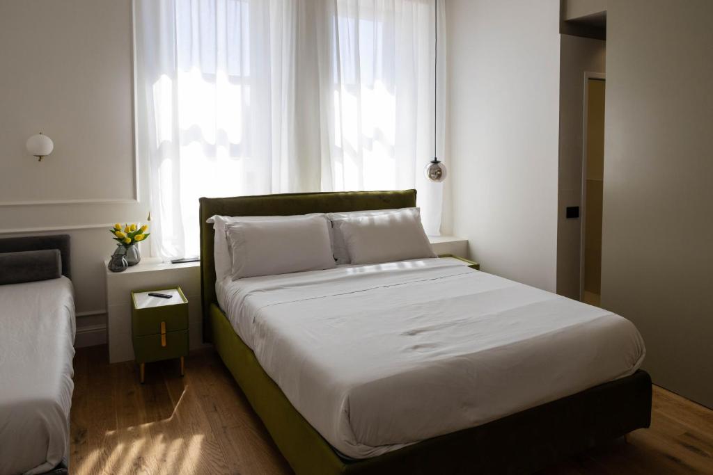 Postel nebo postele na pokoji v ubytování Bed and Breakfast SirenaResina