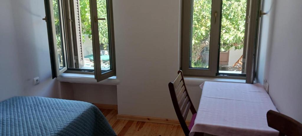 Postel nebo postele na pokoji v ubytování Vagia's Home
