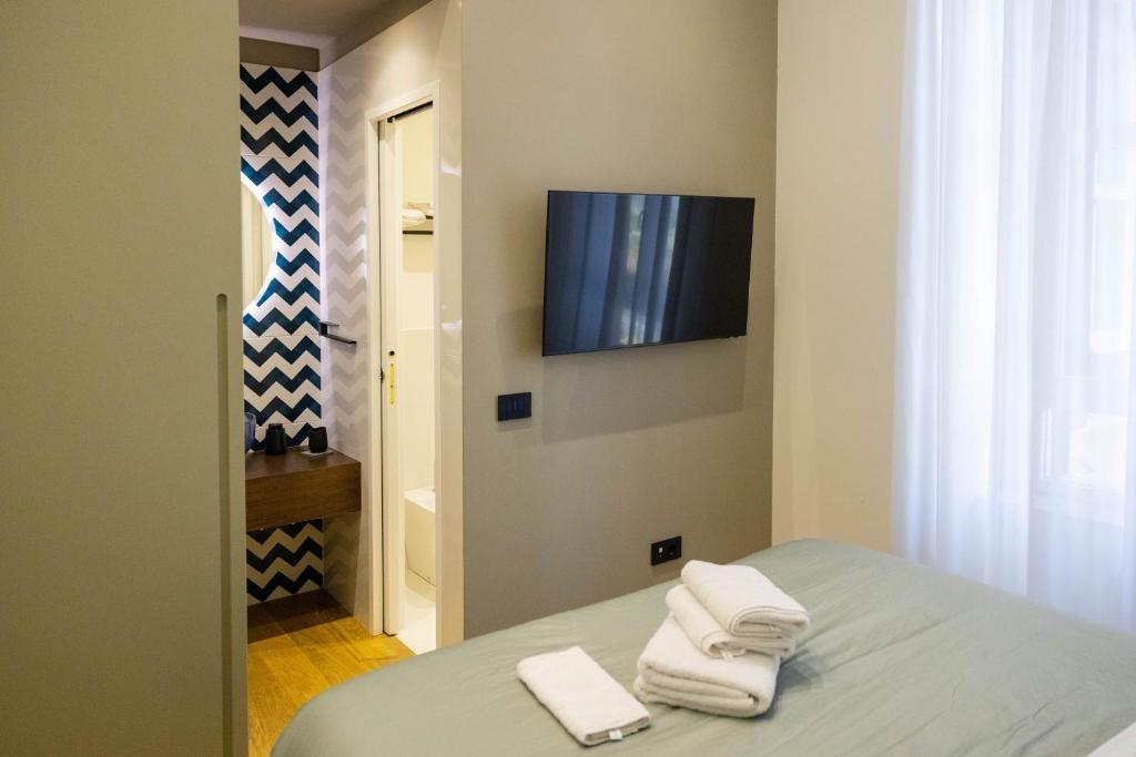 Postel nebo postele na pokoji v ubytování Bed and Breakfast SirenaResina