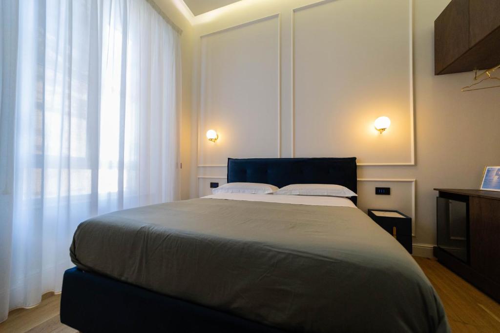 Postel nebo postele na pokoji v ubytování Bed and Breakfast SirenaResina