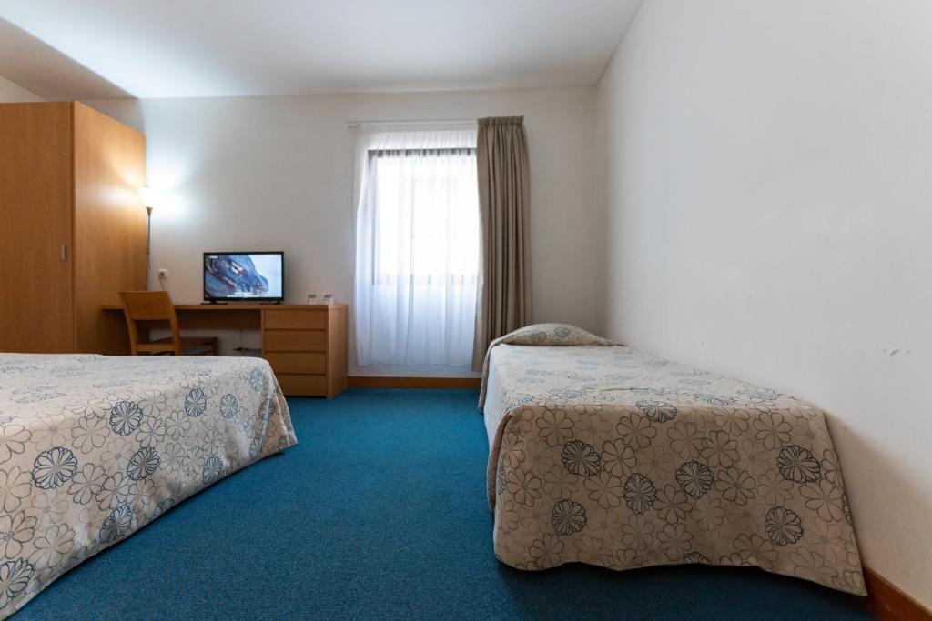 Postel nebo postele na pokoji v ubytování Hotel Matriz