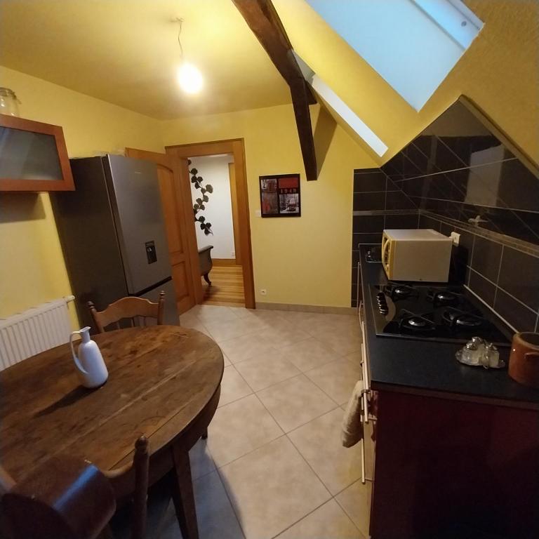 Kuchyň nebo kuchyňský kout v ubytování Chambre