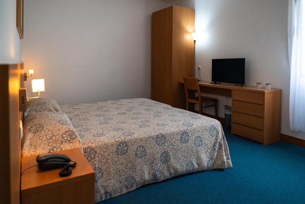 Postel nebo postele na pokoji v ubytování Hotel Matriz