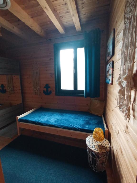 Postel nebo postele na pokoji v ubytování Moon Wood