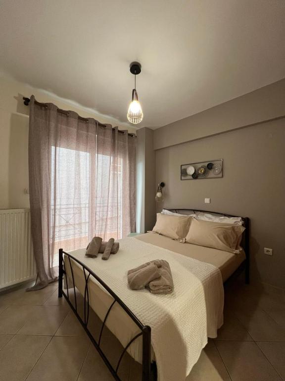 Postel nebo postele na pokoji v ubytování Αγρίνιο κέντρο ΔΣ A2