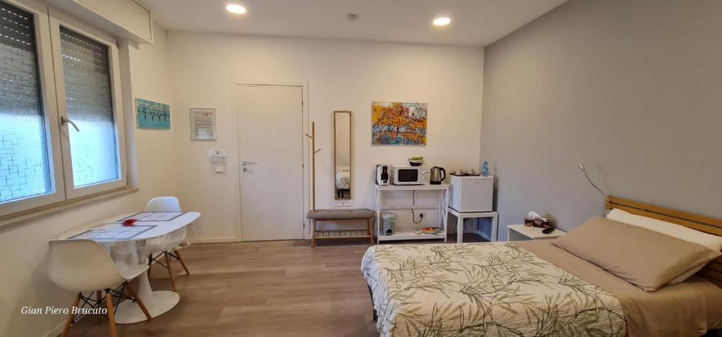 Postel nebo postele na pokoji v ubytování Adriroomsrho