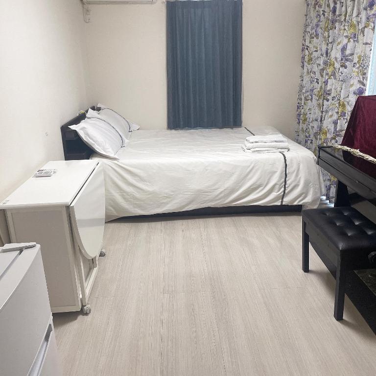 Postel nebo postele na pokoji v ubytování 東京小岩与房东同住mishe