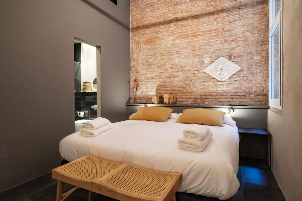 Postel nebo postele na pokoji v ubytování Hostal Porxos Garden