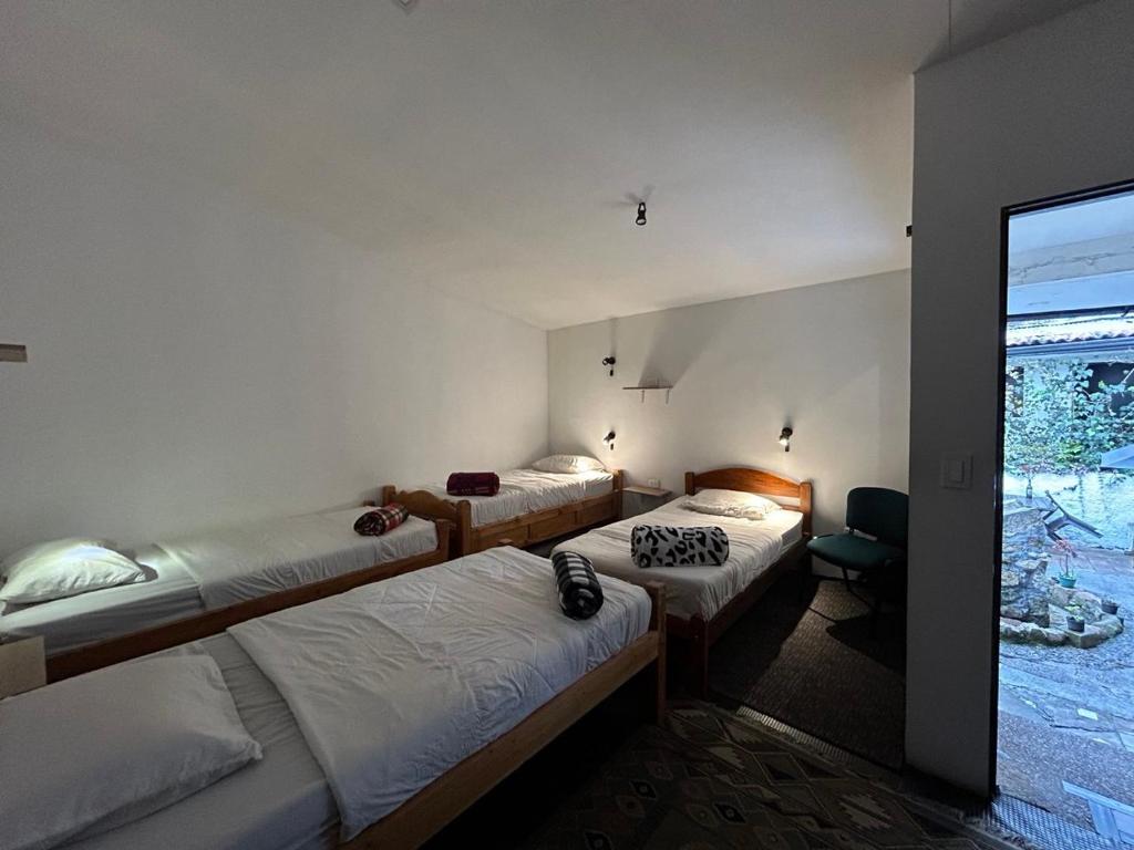 Postel nebo postele na pokoji v ubytování El Yarumo Hostel