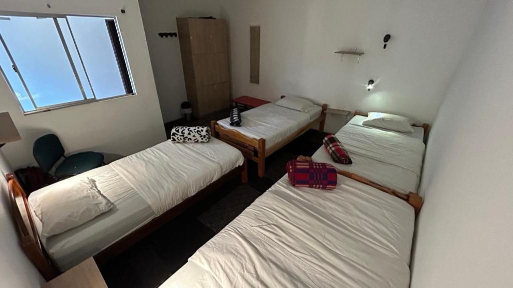 Postel nebo postele na pokoji v ubytování El Yarumo Hostel
