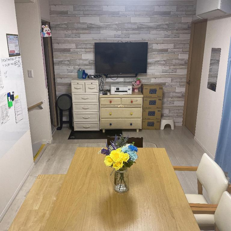 TV a/nebo společenská místnost v ubytování 東京小岩与房东同住mishe