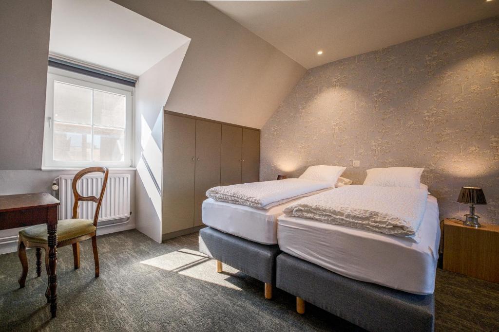 A bed or beds in a room at Guesthouse Gillis7