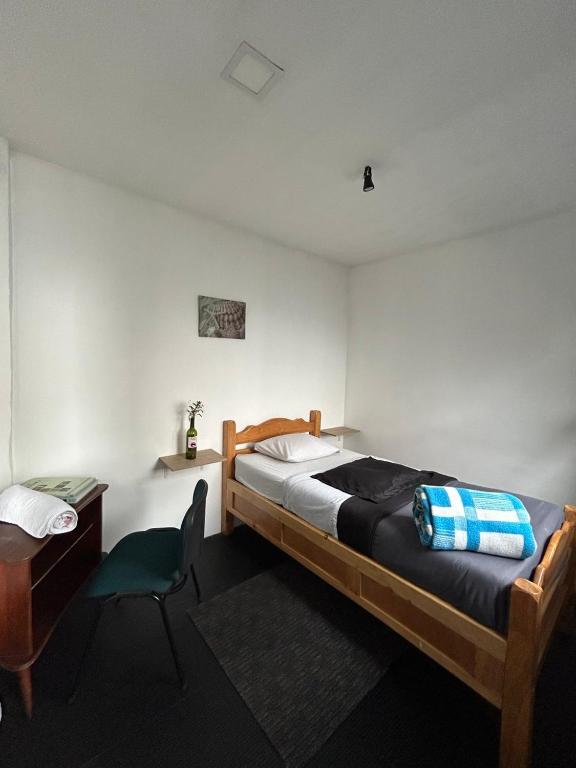 Postel nebo postele na pokoji v ubytování El Yarumo Hostel