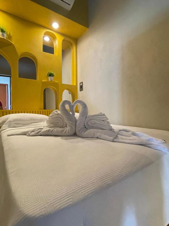Postel nebo postele na pokoji v ubytování Hostal Poquito a Poquito