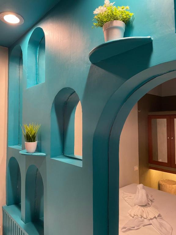 Postel nebo postele na pokoji v ubytování Hostal Poquito a Poquito