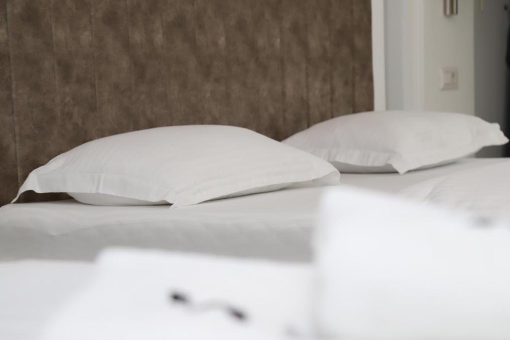 Postel nebo postele na pokoji v ubytování Sky Hotel