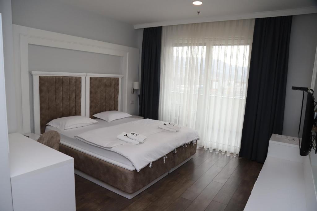 Postel nebo postele na pokoji v ubytování Sky Hotel