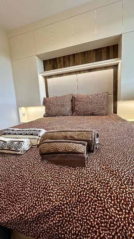 a bed with two pillows on top of it at Apartament Słoneczny in Łańcut