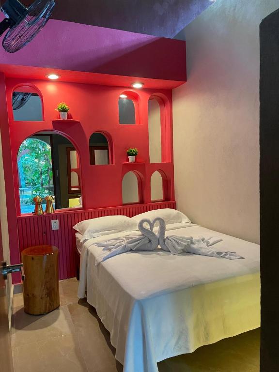 Postel nebo postele na pokoji v ubytování Hostal Poquito a Poquito