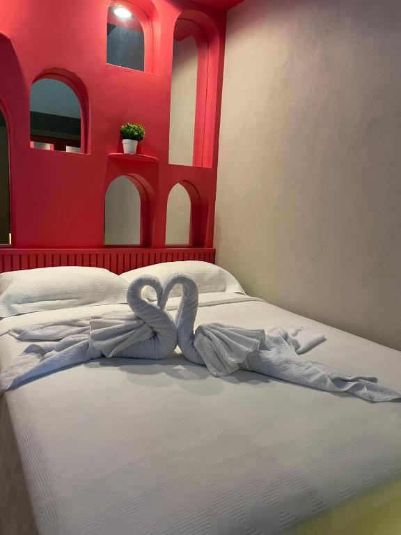 Postel nebo postele na pokoji v ubytování Hostal Poquito a Poquito