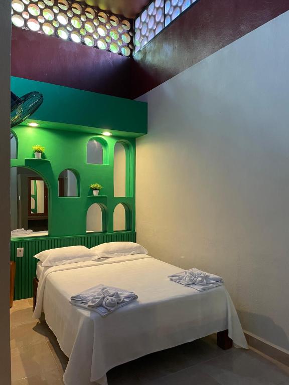 Postel nebo postele na pokoji v ubytování Hostal Poquito a Poquito