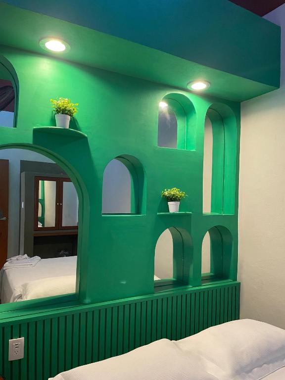 Postel nebo postele na pokoji v ubytování Hostal Poquito a Poquito