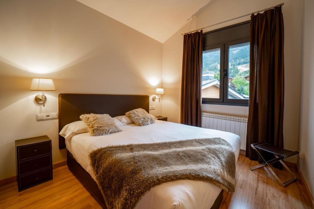 Postel nebo postele na pokoji v ubytování Apartaments Superior
