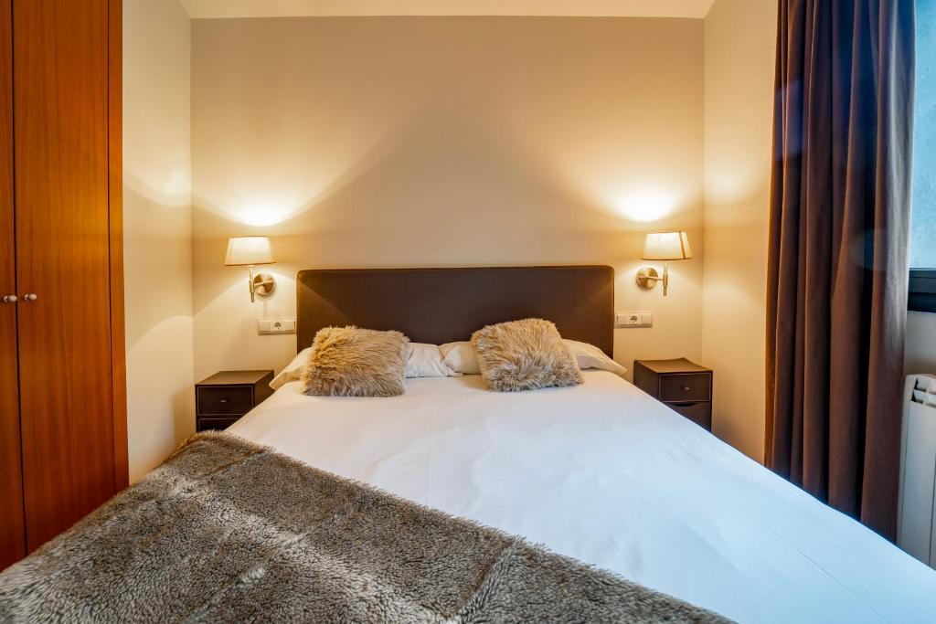 Postel nebo postele na pokoji v ubytování Apartaments Superior