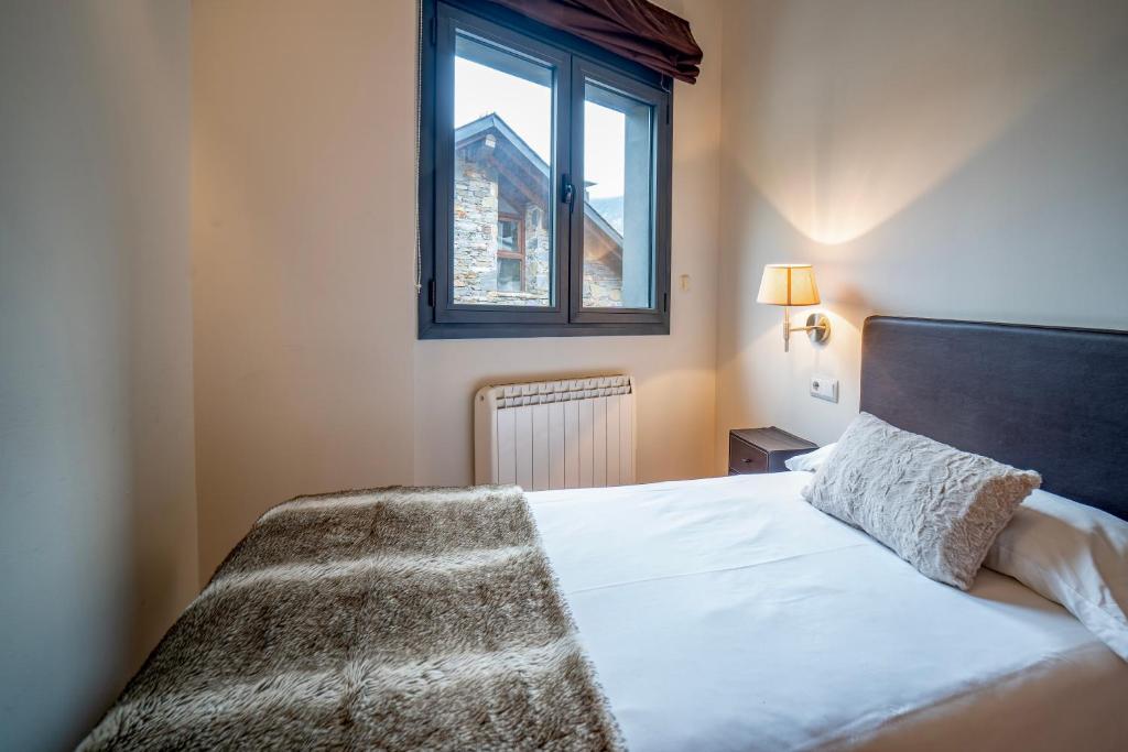 Postel nebo postele na pokoji v ubytování Apartaments Superior