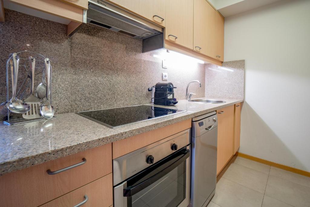 Kuchyň nebo kuchyňský kout v ubytování Apartaments Superior