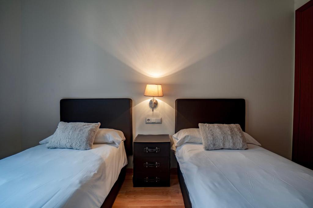 Postel nebo postele na pokoji v ubytování Apartaments Superior