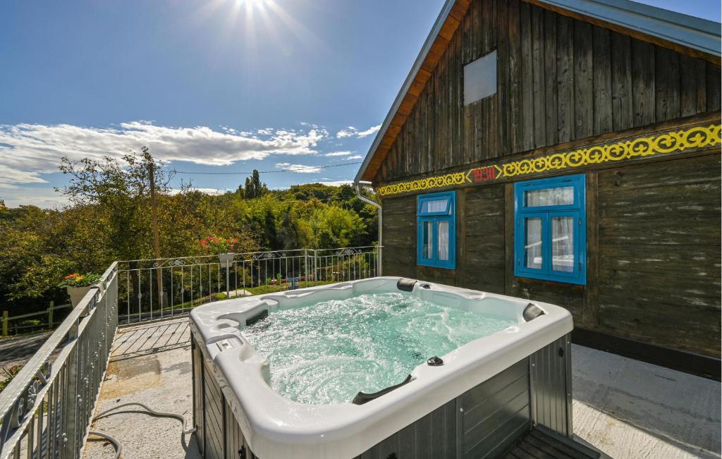 a hot tub on the balcony of a house at 1 Bedroom Cozy Home In Blaskovec in Blaškovec
