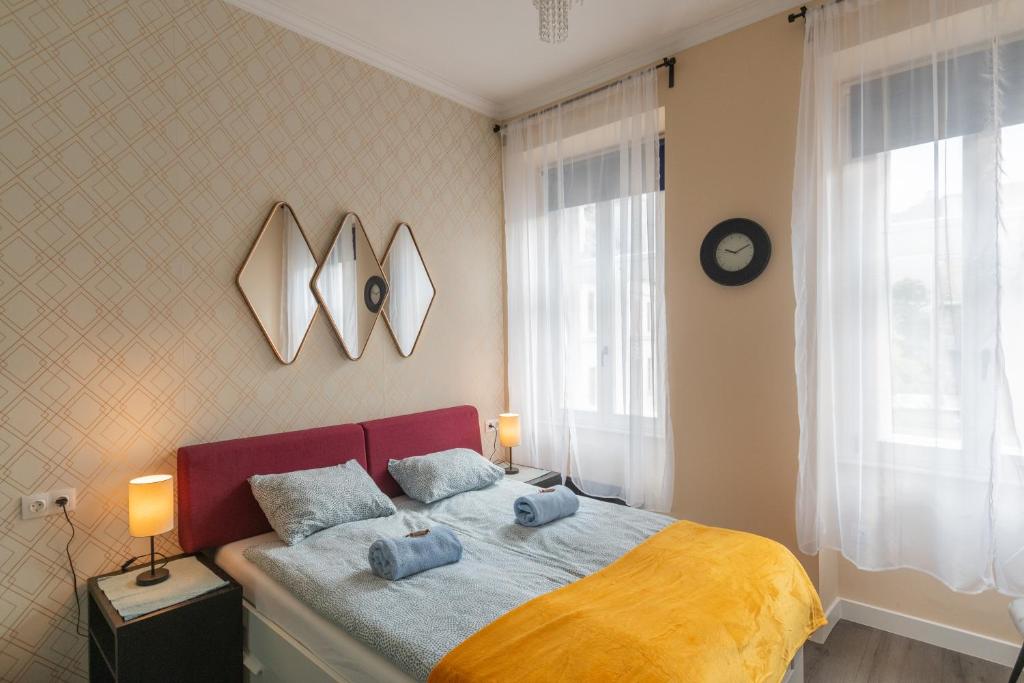 Postel nebo postele na pokoji v ubytování Camilla & Friends House