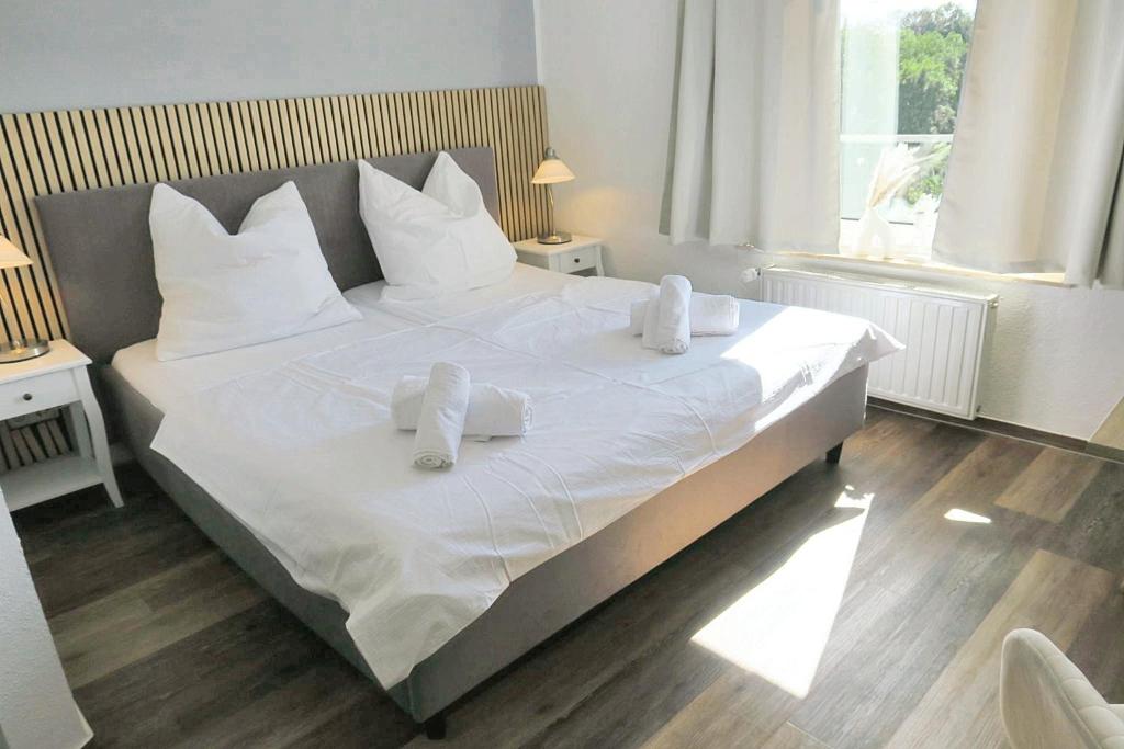 Postel nebo postele na pokoji v ubytování Hotel Marina