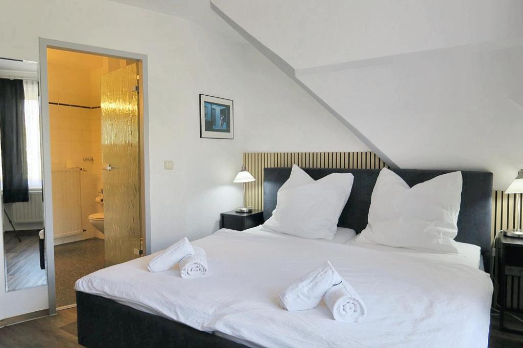 Postel nebo postele na pokoji v ubytování Hotel Marina