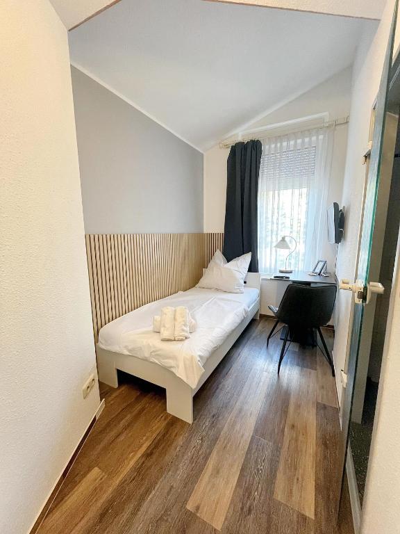 Postel nebo postele na pokoji v ubytování Hotel Marina
