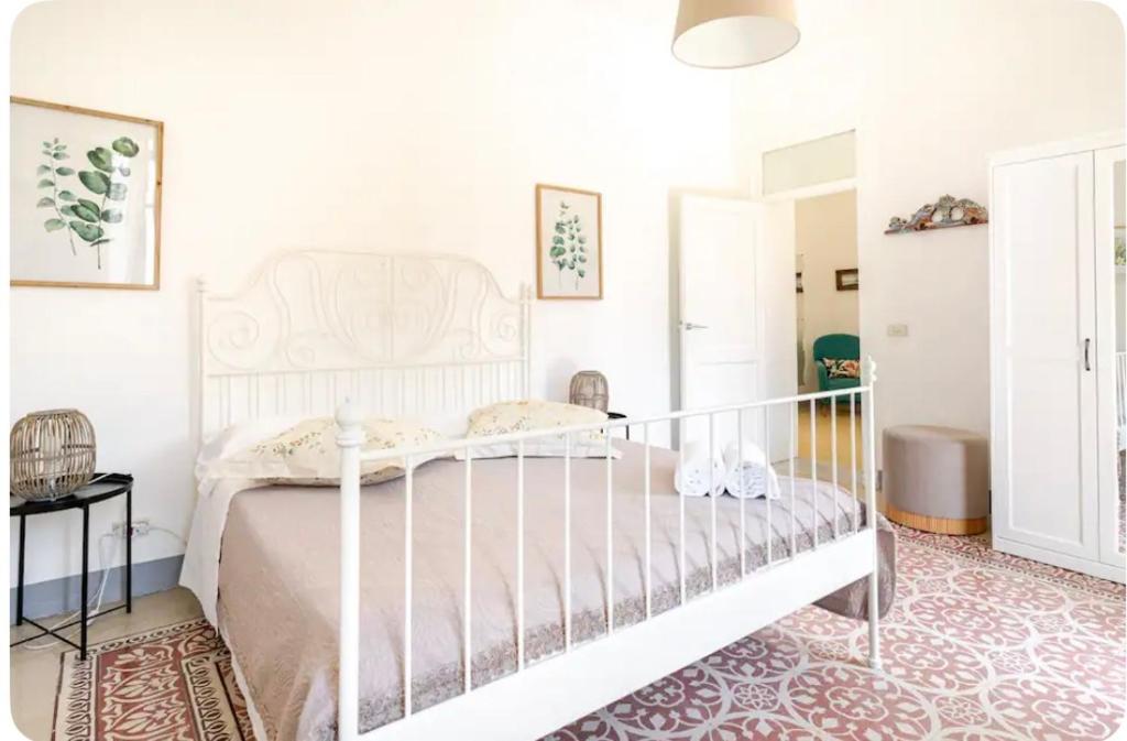 Ένα ή περισσότερα κρεβάτια σε δωμάτιο στο Amarea Casa Vacanze