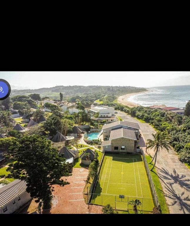 an aerial view of a tennis court on the beach at Banana Beach Club-RY in Port Shepstone