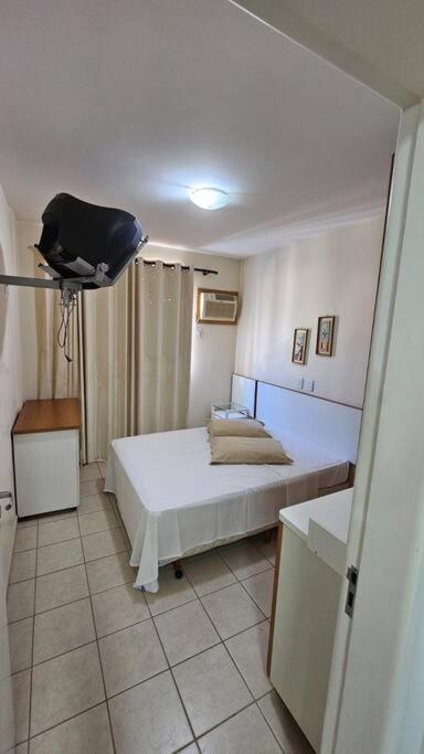 a bedroom with a bed in a room at Lindo Flat ao lado do Hot Park - Cond Serra Park -Apt 121 in Rio Quente